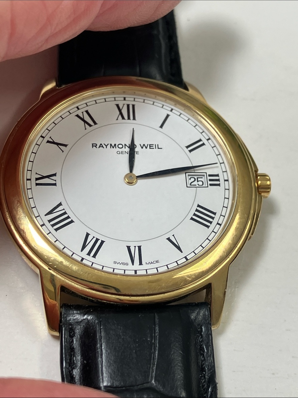 Raymond Weil Gold Case Watch with White Dial. It’s in wonderful condition.